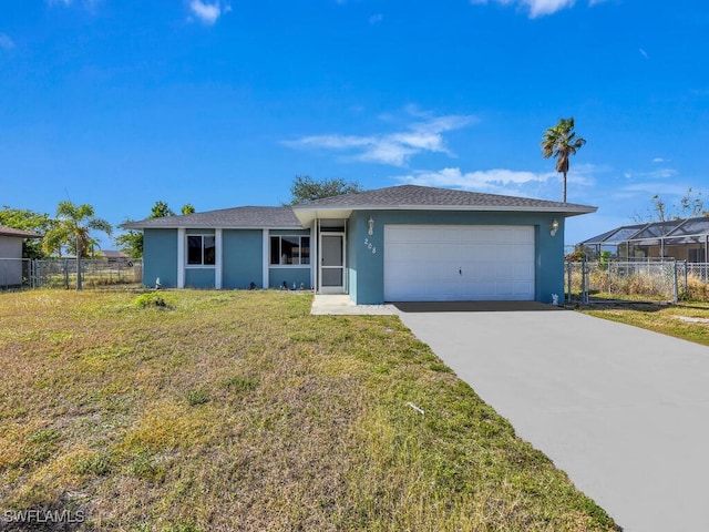 ranch-style home featuring a garage and a front lawn