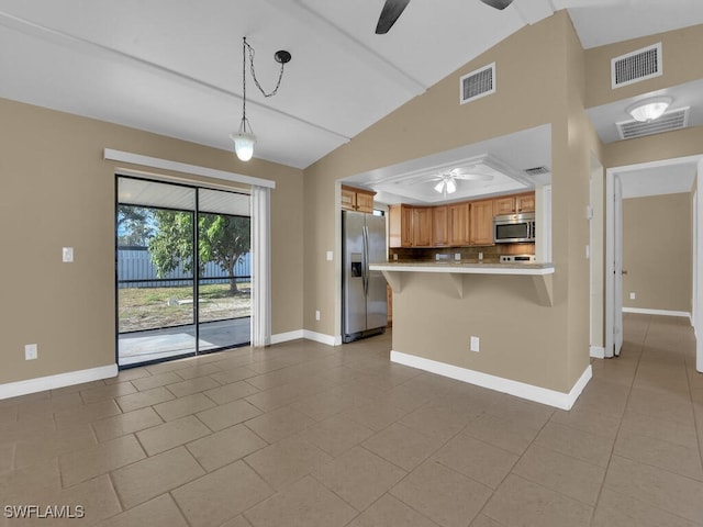 kitchen featuring stainless steel appliances, backsplash, kitchen peninsula, vaulted ceiling, and light tile patterned floors