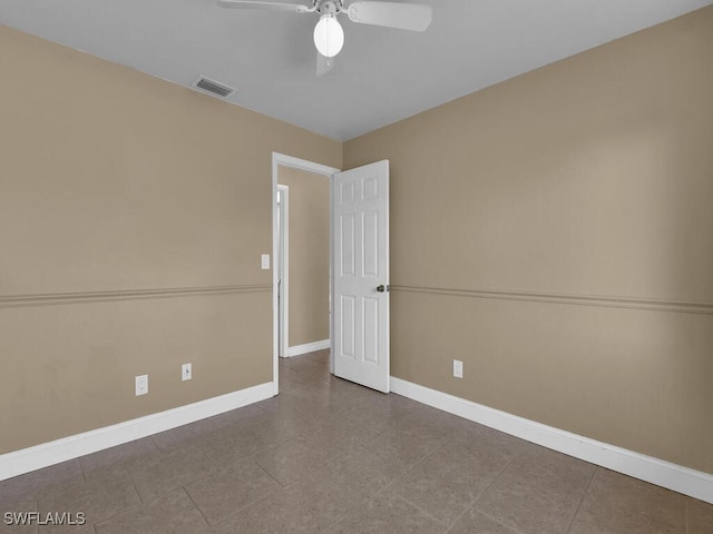 spare room with ceiling fan