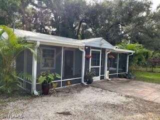 view of front of house featuring a sunroom