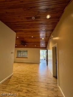 corridor with wooden ceiling and light hardwood / wood-style floors