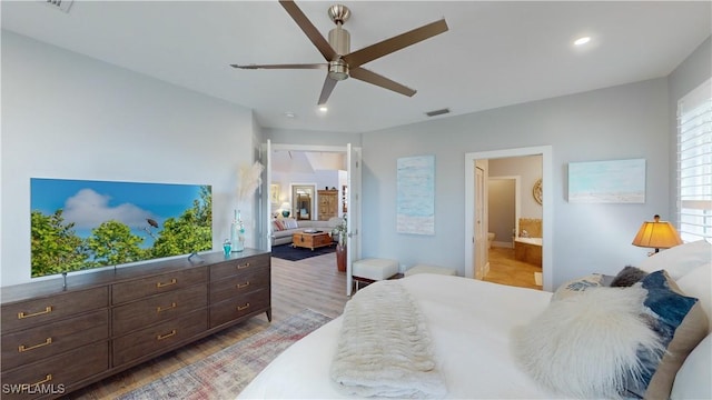 bedroom with visible vents, ensuite bath, ceiling fan, light wood-style floors, and recessed lighting