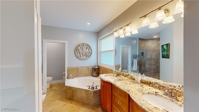 bathroom featuring toilet, a shower stall, a sink, and a bath