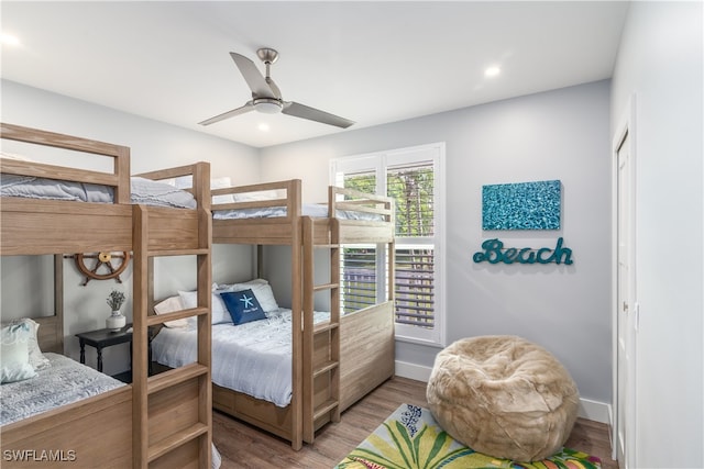 bedroom featuring recessed lighting, ceiling fan, baseboards, and wood finished floors