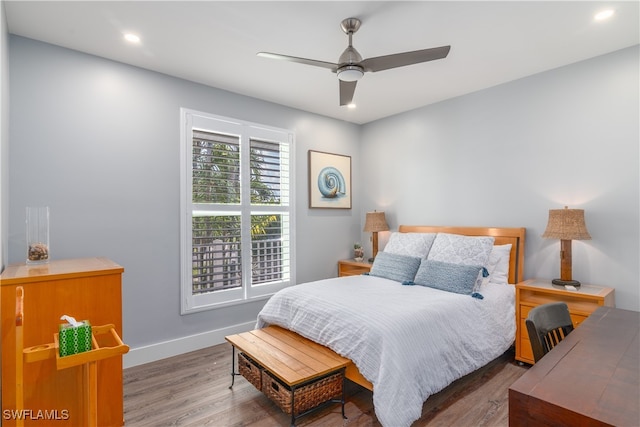 bedroom featuring ceiling fan, baseboards, wood finished floors, and recessed lighting