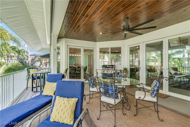 exterior space with ceiling fan, french doors, grilling area, and outdoor dining space