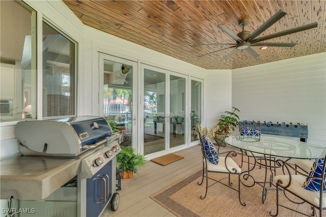 deck with area for grilling, a ceiling fan, and french doors