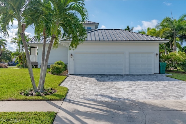 garage with decorative driveway