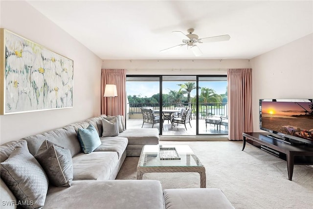 living room featuring carpet flooring and ceiling fan