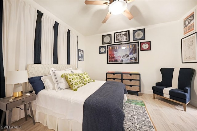 bedroom with light wood-type flooring and ceiling fan