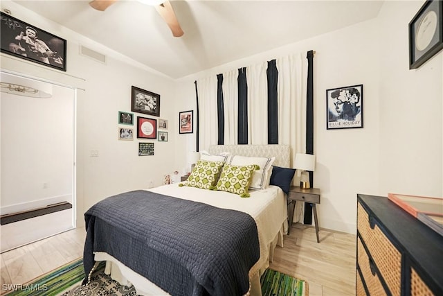 bedroom with ceiling fan and light wood-type flooring