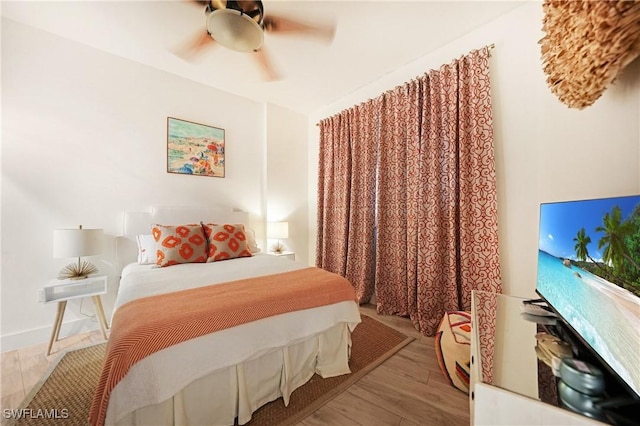 bedroom featuring ceiling fan and light wood-type flooring