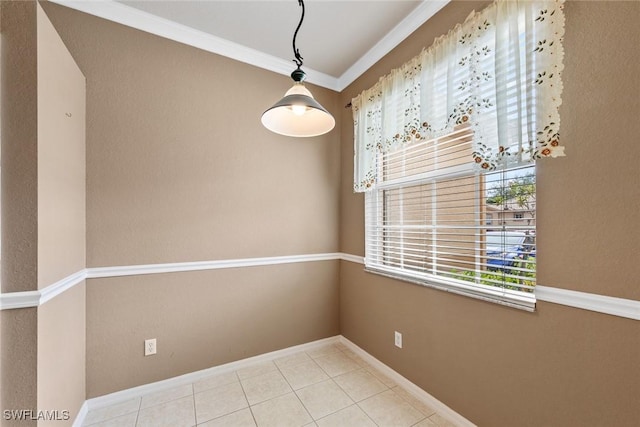 unfurnished room with light tile patterned floors and crown molding