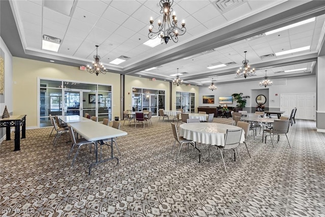 carpeted dining room featuring a towering ceiling, crown molding, and a tray ceiling