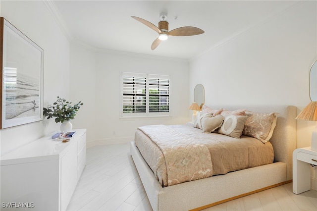 bedroom with ceiling fan and crown molding