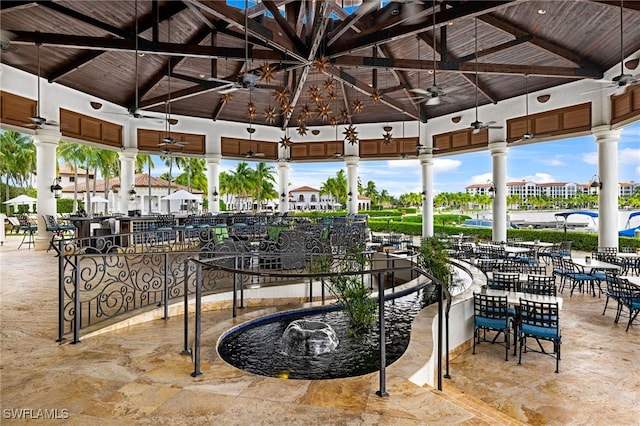 view of patio / terrace featuring a gazebo and ceiling fan