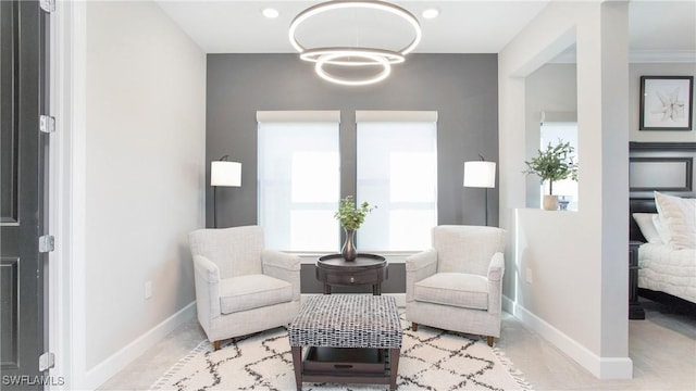 sitting room featuring crown molding