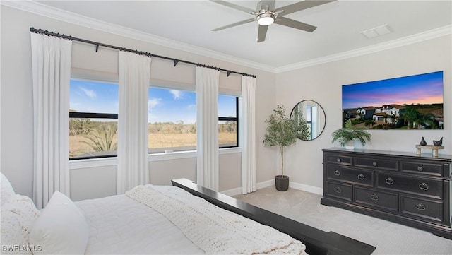 carpeted bedroom featuring ceiling fan and ornamental molding