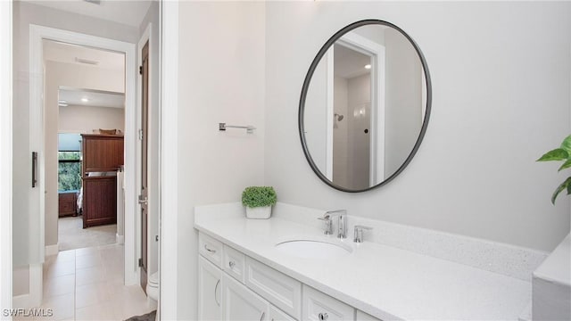 bathroom featuring walk in shower, tile patterned flooring, vanity, and toilet