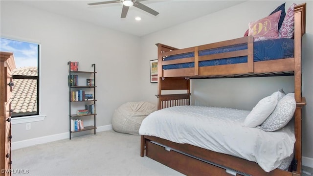 bedroom featuring ceiling fan and light carpet