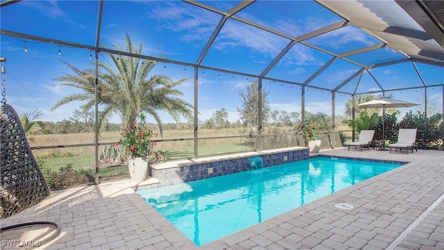 view of pool featuring a patio area and a lanai