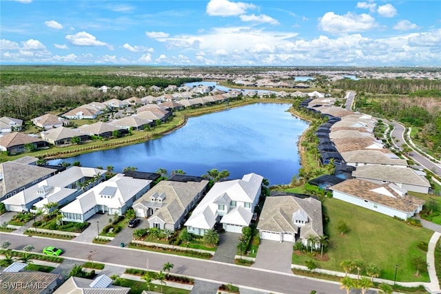 birds eye view of property featuring a residential view and a water view