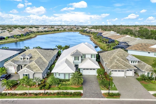 bird's eye view with a residential view and a water view