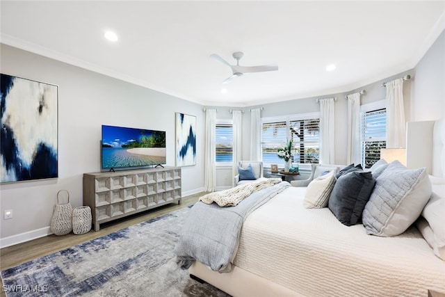 bedroom featuring crown molding, baseboards, recessed lighting, wood finished floors, and a ceiling fan