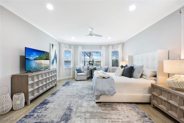 bedroom featuring a ceiling fan, recessed lighting, wood finished floors, and ornamental molding