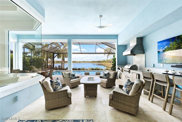 living area featuring a ceiling fan and a sunroom