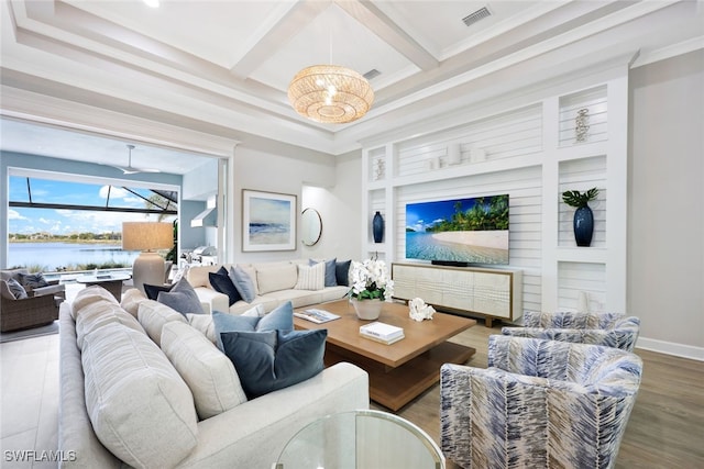 living area featuring visible vents, coffered ceiling, beamed ceiling, and crown molding