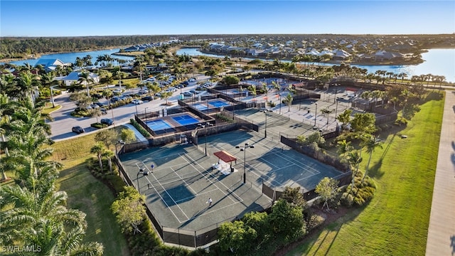 birds eye view of property with a water view