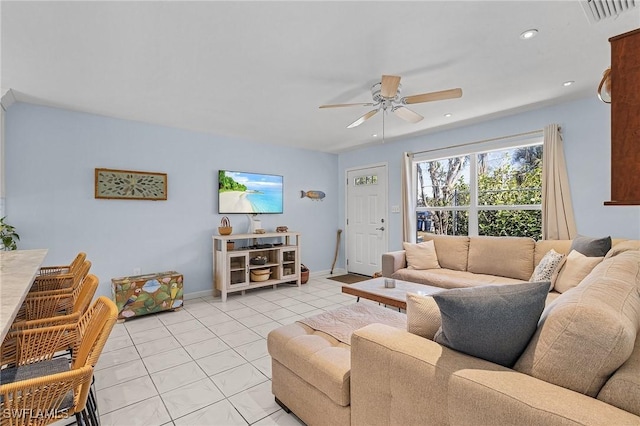 living room with ceiling fan and light tile patterned flooring