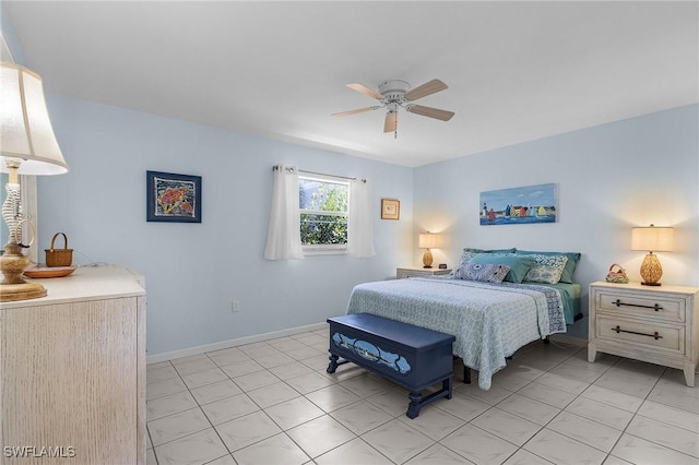 tiled bedroom with ceiling fan