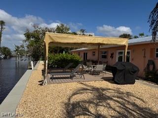 back of house featuring a water view