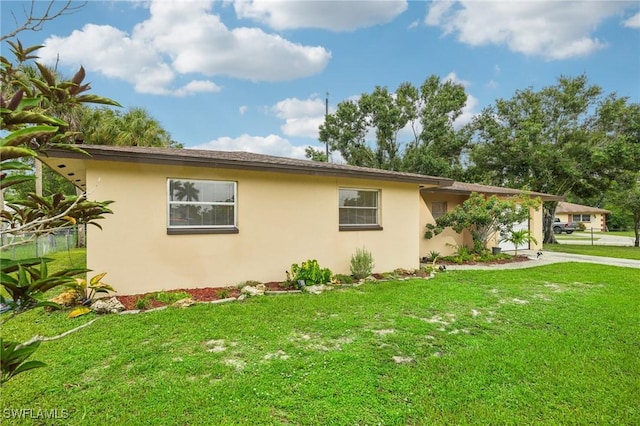 view of side of property featuring a yard