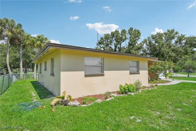 view of home's exterior featuring a lawn