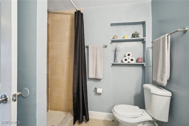 bathroom with tile patterned floors, toilet, and a shower with shower curtain