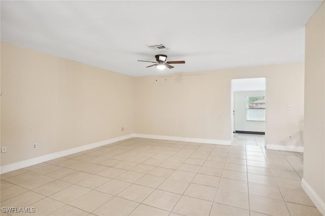 unfurnished room featuring light tile patterned floors and ceiling fan