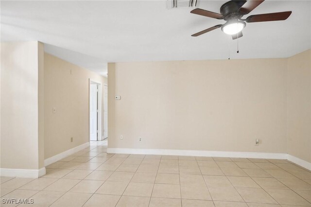 unfurnished room with ceiling fan and light tile patterned flooring