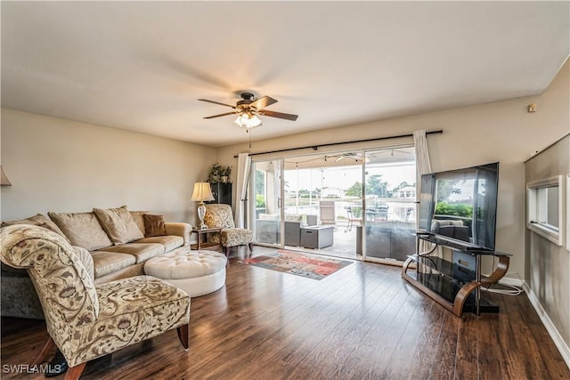 living room featuring ceiling fan and wood-type flooring