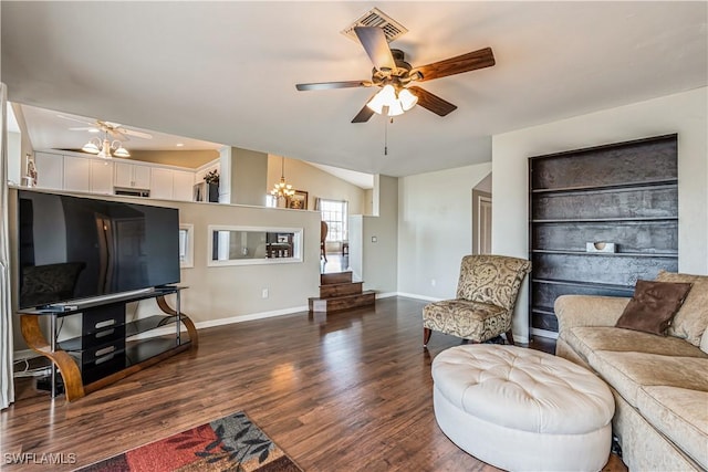 living room with dark hardwood / wood-style flooring, ceiling fan with notable chandelier, and vaulted ceiling