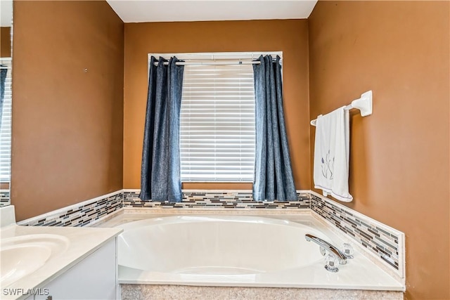 bathroom with vanity and a bathtub