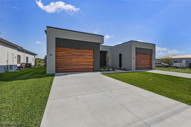 modern home featuring a front lawn