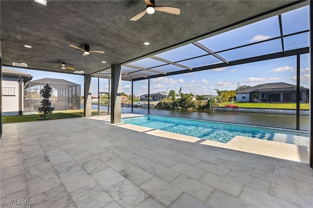 view of pool with a water view, a patio area, ceiling fan, and a lanai