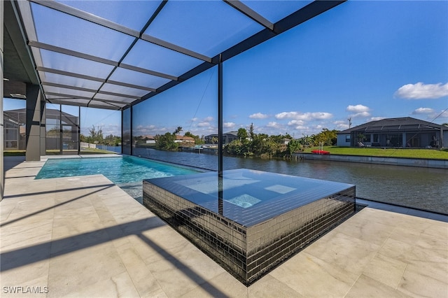 view of swimming pool with glass enclosure, a patio area, an in ground hot tub, and a water view