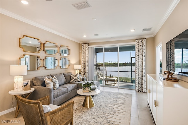 tiled living room with a water view and ornamental molding