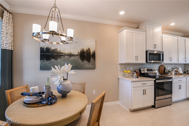 kitchen with backsplash, hanging light fixtures, a notable chandelier, white cabinetry, and stainless steel appliances