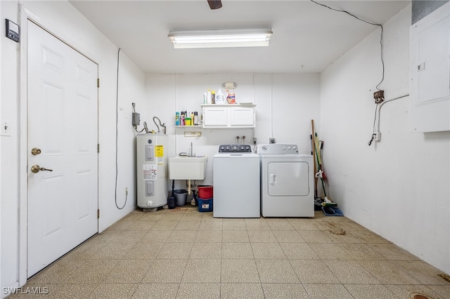 laundry room featuring cabinets, electric water heater, sink, separate washer and dryer, and electric panel