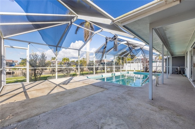 view of pool with a lanai and a patio area